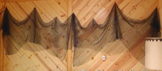 Two pieces of decorative fish netting. Measure approx. 10' as pictured across wall.