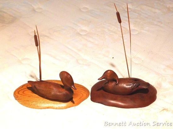 Two wooden duck pieces with cattail accents. Each piece is approx. 9" wide and 4" tall without