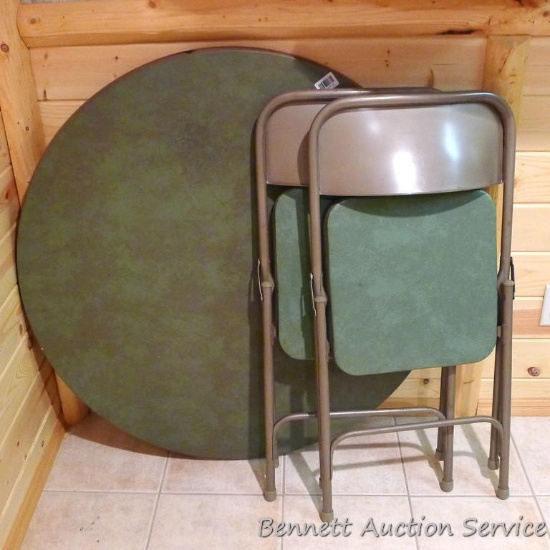 Folding card table with two chairs. Table is 40" diameter. Sturdy set in good shape.
