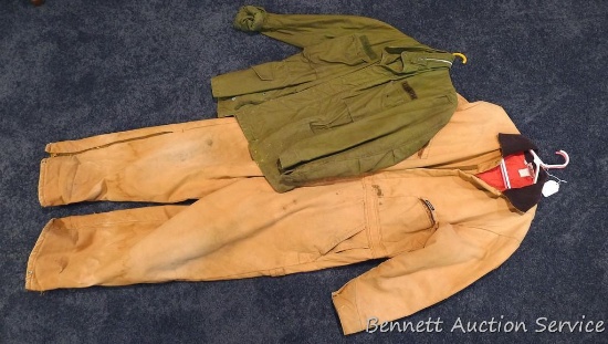 Dickies coveralls are marked 45/48 chest, medium length. Plus an M65 field jacket shell with US Army