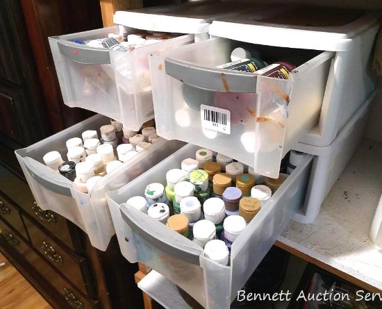 Four Sterilite organizer drawers full of craft paint. All stored inside.