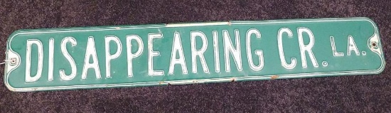 Decommissioned stamped steel road sign from Disappearing Creek Lane, 3' wide.