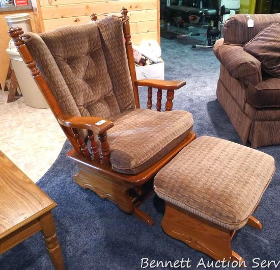 Oak glider rocker with gliding ottoman. Both pieces are smooth and very comfortable. Neutral tones,