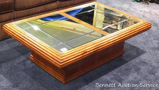 Rolling coffee table with mirrored inserts measures 4' x 2-1/2'.