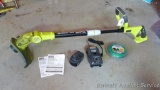 Ryobi 18 volt cordless weed trimmer comes with charger, manual and extra line. Works.