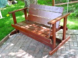 Glider patio swing is over 5' wide.