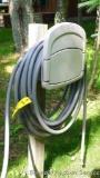 Suncast HoseHangout wall mount hose keeper with storage and garden hose. Please bring tools to
