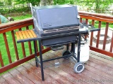 Weber gas grill with three burners, newer style tank and cover. 24