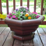 Well made patio or deck planter is over 2' across. Comes with a nice variety of flowers. Bring a