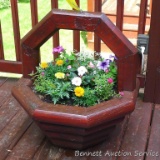 Well made patio or deck planter is 2-1/2' tall. Comes with a nice variety of flowers. Bring a hand