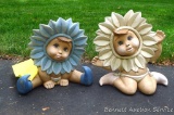 Two little flower faced garden gnomes, each approx. 10