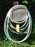Suncast Hose Hangout wall mount hose keeper plus a length of garden hose. Please bring tools to