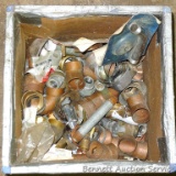 Partial crate full of plumbing fittings, includes nipples, copper and more.