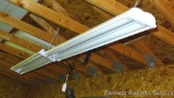 Two 4' fluorescent hanging light fixtures with tubes. Bring a step stool to get them down.