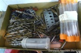 Large assortment of metal drill bits; drill gauge; largest bit is 3/4