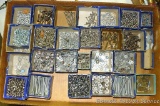 Assortment of machine screws, metal screws, washers and nuts.