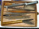 Round chain saw files; file cleaners; brass tube filled with small files.