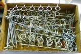Box full of peg board hangers.