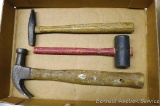Claw hammer; rubber mallet; upholstery hammer. All appear in good shape.