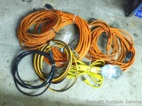 Four extension cords, various lengths. One has trouble light.