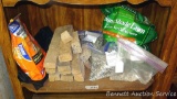 No shipping. Partial bags of grass seed, fertilizer and Terro ant killer, plus a few stone fa?ade