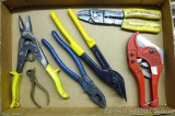 Wire strippers; strap cutters; tin snips; electrician's pliers.