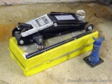 Sears hydraulic floor jack with handle. Lifts 3,300 lbs. Model #214.125100. Comes in plastic