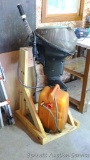 Johnson outboard boat motor is Model No. MQ-14E comes with stand and 6 gallon gas can. Turns over