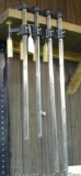 Four metal bar clamps, longest is 27