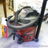 Craftsman wet/dry 6.0 shop vac. Includes extra hose and attachments.