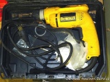 DeWalt 3/8 reversible drill with cordless chuck. Comes in plastic carrying case.