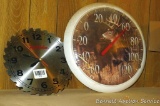 True Value saw blade clock, needs battery; White tail deer thermometer.