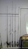 Five fishing rods with reels, tallest is 80