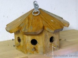 Hanging wooden bird house, octagon shape.