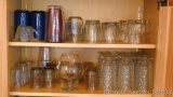 Footed iced tea glasses; juice glasses; other assorted glasses.
