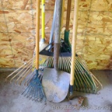 New corn broom, wall mount hose keeper, small and large leaf rakes, hoe, dirt spade, more.