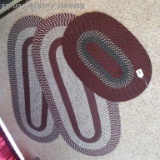 Three braided rugs. Largest is 28
