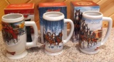 2006-2008 Budweiser Holiday beer steins with original boxes. Largest is 7