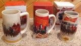 2012-2014 Budweiser Holiday beer steins with original boxes. Largest is 7
