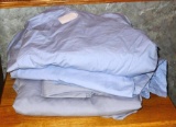 Two king sized sets of sheets, one set has pillow cases. These two sets have deep sides.