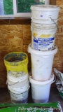 Two stacks of buckets, taller stack is over 4'.
