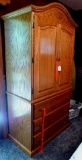 Wolfcraft armoire made of oak has 3 shelves and 3 drawers. All work good. 39