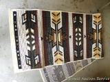 Earth toned runner rug measures approx. 84
