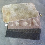 Four throw rugs, longest is over 3'.
