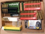 Assorted cartridges including .30-06, .35 Remington, .22LR, plus a MasterLock brand trigger lock.