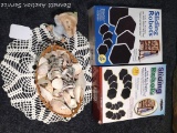 Partial boxes of sliding robots, plus a basket of sea shells and more.