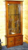 Wooden gun cabinet with two locking storage areas and etched glass door is approx. 29