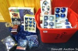 Tote full of Christmas decorations, mostly blue. Plus a Christmas tree stand.