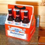 1998 Budweiser ceramic coin bank with some contents. Stands nearly 8