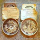 Two Incolay collector's plates with certificates of original ownership. One titled 'She Walks in